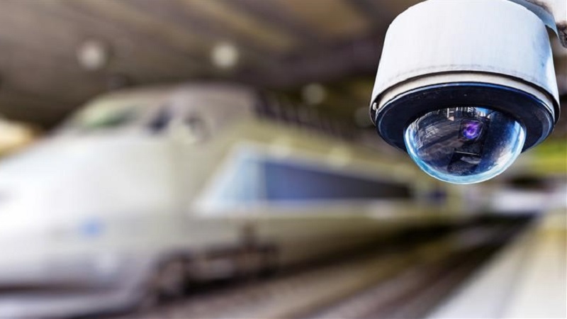 A surveilliance camera in a train station.